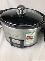 Cuisinart 3.5-quart programmable slow cooker with glass lid and digital control panel.