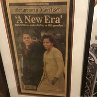 Framed Montgomery Advertiser commemorative newspaper titled 'A New Era' featuring Barack Obama and Michelle Obama from January 21, 2009, 44th President of USA