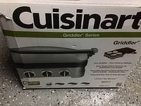 Photo of original box of Cuisinart Griddler showing product details and features.