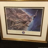Full framed vintage print titled 'On Target' showing two WWII aircraft over terrain, in an ornate gold frame.