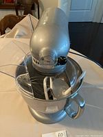 Tilt-head mixer in upright position showing bowl and pouring shield