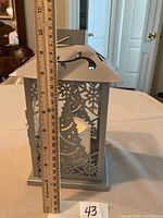 Photo of Christmas LED lantern with a ruler next to it showing the height of approx 10 inches.