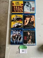 Top view of six Blu-Ray movie cases arranged in two columns and three rows showing titles and cover art.