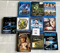 Top-down view of all 10 Blu-ray movie cases arranged on a surface.
