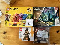 Photo showing three Lego sets: Classic 11002, Hidden Side set, Halloween figure 40204 and loose pieces in bag labeled 10673 Race Car Rally.