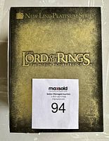 Slipcase box for The Lord of the Rings New Line Platinum Series Trilogy set showing title and branding in weathered gold and black design.
