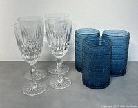 Photo showing 4 clear Scottish Edinburgh wine glasses and 3 blue Jupiter Cornflower blue drink glasses together