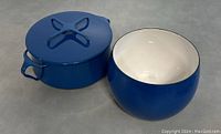 Both Dansk enamel pot and bowl shown side by side on flat surface showcasing size and color.