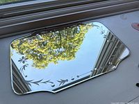 Full top-down view of the rectangular etched mirror showing beveled edges and floral motifs on corners.