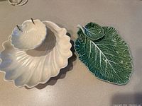 Two vintage chip and dip sets seen side by side; white shell-shaped set marked Maddux of Calif and green leaf-shaped set marked Bordello Pinheiro Portugal