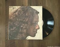 Album cover of Carole King Rhymes & Reasons with vinyl partially out