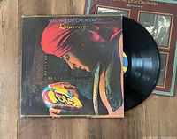 Electric Light Orchestra Discovery album jacket partially opened showing vinyl record