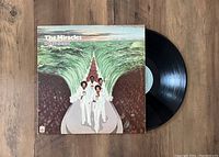 Vinyl record LP titled 'Do It Baby' by The Miracles with original album cover featuring the band walking on a path through parted water