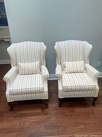 Both chairs front view with matching lumbar pillows