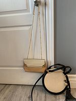 Full view of both bags hanging on door knob