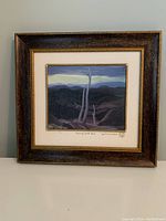 Front view of framed artwork showing the full composition and double frame.