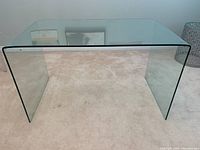 Front angled view showing curved glass top and sides