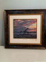 Framed art print "Split Rock Gap" by Tom Thomson showing full framed view with sunset landscape and rock formation.