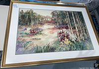 Full view of the framed landscape print by Rankin showing the gold frame and matting