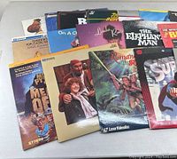 Photo showing a wide spread of LaserDisc titles including The Roman Spring of Mrs. Stone, Linda Ronstadt, The Elephant Man, Superman The Movie, Jaws 3, and others.