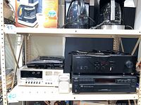 Yamaha RS201 stereo receiver, JVC XL F108 5 disc CD player, Pioneer CT F2121 cassette deck, and small speaker on shelf