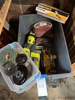 Overview photo showing the RYOBI cordless sander and grinder, DeWalt cordless planer, Central Pneumatic belt sander in box, and the Aleko sanding belts.