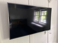 Front view of Samsung 42" TV mounted on wall