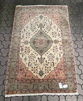 Top-down view of entire rug laid on stone floor showing overall design and proportions