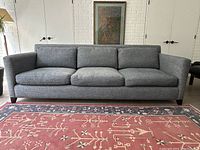 Straight-on front view of the sofa showing overall design and condition