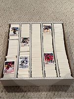 Top-down view of the lot showing hundreds of neatly organized Upper Deck 1991-1992 NHL hockey cards arranged vertically in several columns inside a white cardboard box.