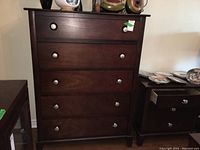 Front view of the highboy chest showing five drawers with round metal pulls in a dark wood finish.