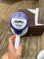 Front view of megaphone showing control panel with OFF/ON switch, SIREN, RECORD, PLAY, VOLUME control, and red indicator lights.