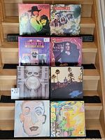 Front view of eight vinyl record covers arranged in two rows of four. Shows artists The Strawbs, The Amblers, Nina Simone, Golden 50's Hits, Pink Floyd, Eagles, and others.