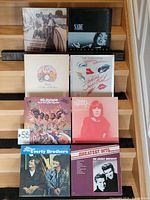 Eight vinyl records displayed with front covers visible for identification