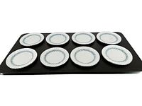 Set of 8 bread and butter plates displaying blue leafy pattern and silver scalloped edges with silver trim