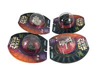 Four Star Wars Micro Machines diecast vehicles in original blister packaging: Millennium Falcon, TIE Fighter, Imperial Star Destroyer, X-Wing Starfighter.