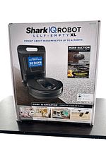 Front of boxed Shark IQ Robot Self-Empty XL packaging showing model name, branding and key feature callouts.