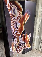Full view of room divider showing giraffe print side, three panels folded slightly.