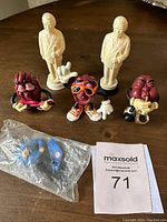 Overview photo of all 5 figurines: 2 Colonel Sanders, 3 California Raisins.