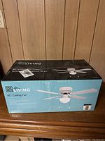 Photo of unopened Ice Living 42 Inch Ceiling Fan box showing product image and branding.