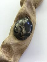 Front view of the domed boulder agate pendant showing natural stone patterns and polished surface.