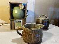 Green Starbucks teapot boxed with Tazo Zen tea sachets visible