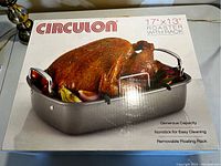 Photo of Circulon 17"x13" roaster with rack box showing cooked turkey image and product features including generous capacity, nonstick coating, removable floating rack, and oven safe to 450F.