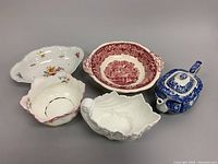 Photo showing the full set of chinaware including the Coalport shell dish, Masons bowl, white shell dish, and Spode Blue Italian teapot.