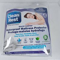 Photo of front packaging of Clean Rest Waterproof Mattress Protector showing the product name, size, and key features.