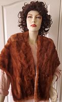 Front view of mannequin wearing a rich brown vintage Eaton Fur Salon lined fur wrap, showing fur texture and color.