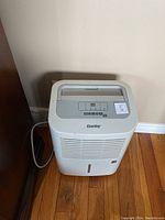 Front view of Danby dehumidifier showing control panel and air vents.