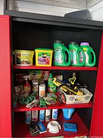 Overview of items on shelf including Miracle-Gro products, garden ties, sprinkler, and spa products