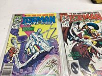 Front covers of Iceman issues #1 and #2, showing main characters and colorful action scenes.