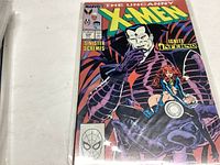 Front cover of The Uncanny X-Men Comic Book issue 239 showing the title, characters, and publisher.